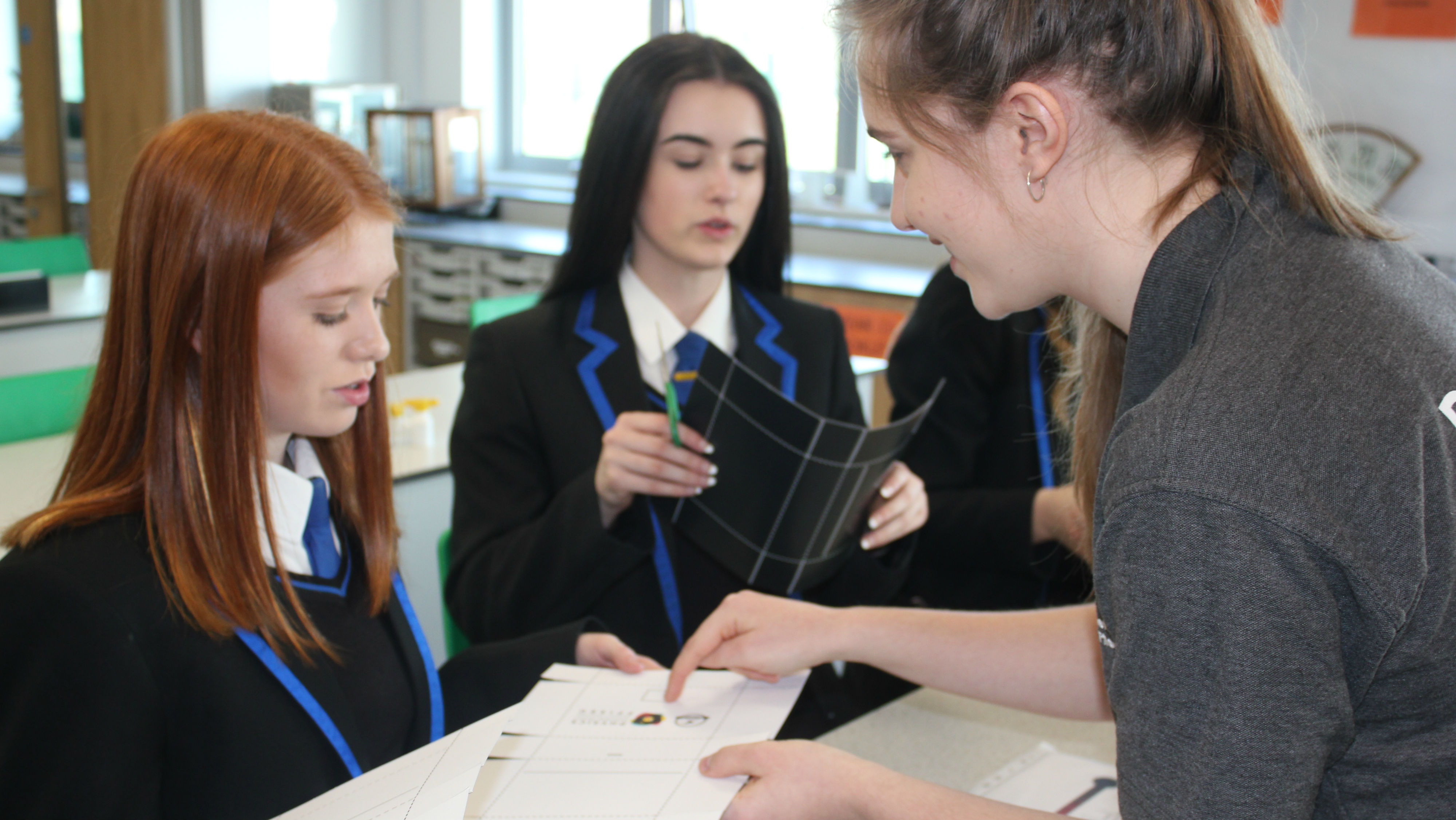Students taking part in physics lesson