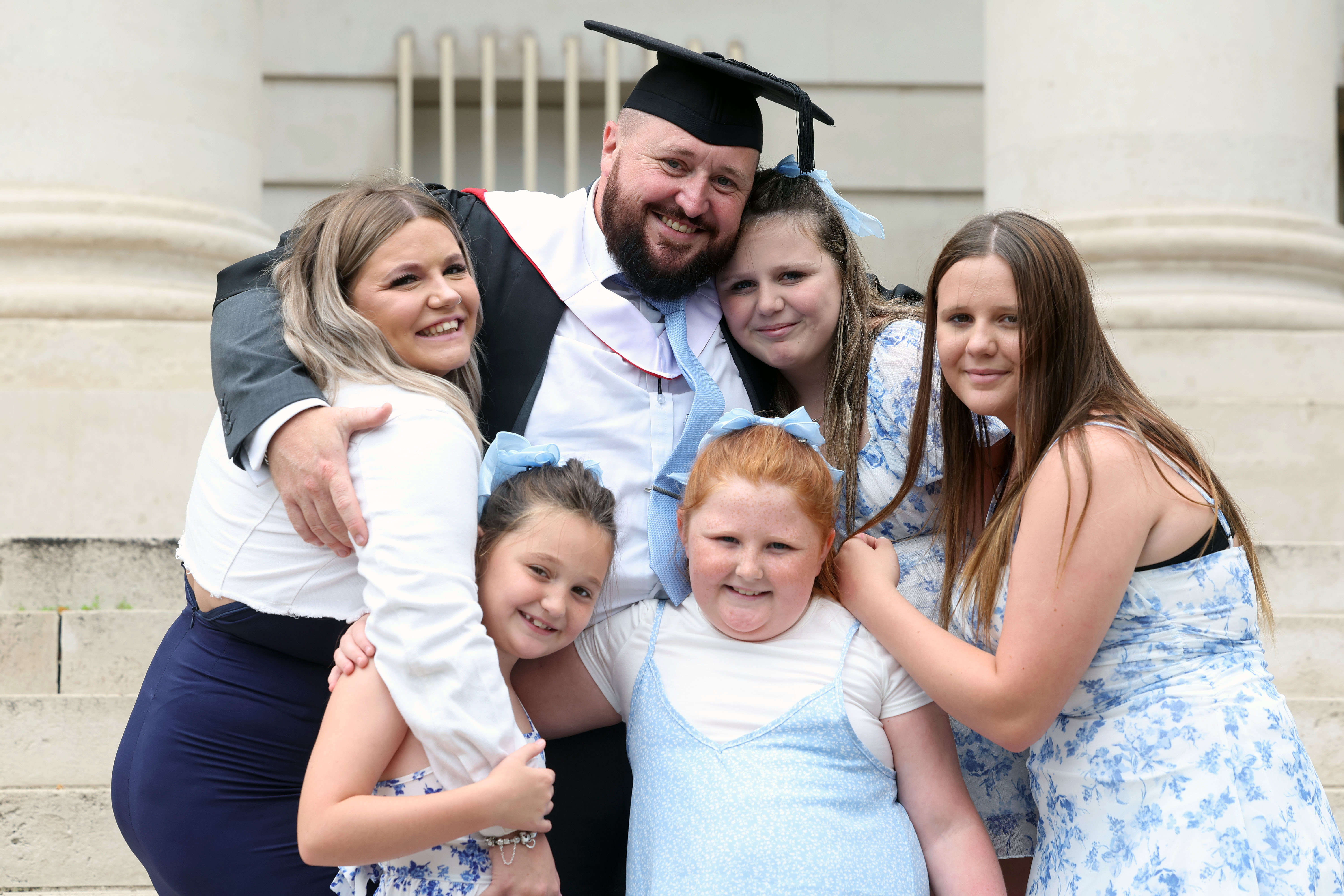 Former postie celebrates First-Class Honours with family - News ...